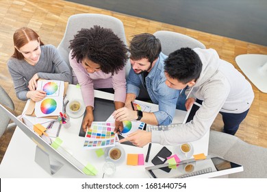 Start-up team brainstorming about color design in the office of a design agency - Powered by Shutterstock