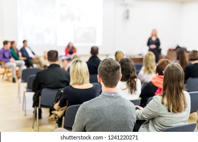 Startup team giving a pitch deck presentation in conference hall at business event. Audience at the conference hall. Business and Entrepreneurship concept. Focus on unrecognizable people in audience. - Shutterstock ID 1241220271