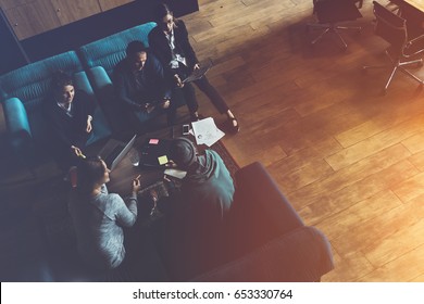 Startup Team. Meeting On The Couch. Loft Office. Five People