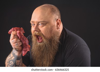 Starving Fat Man Looking At Meat