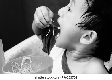 Starving Street Kids Eating Noodles In Black And White Colour Tone