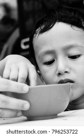 Starving Street Kids Eating Noodles In Black And White Colour Tone