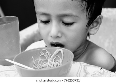 Starving Street Kids Eating Noodles In Black And White Colour Tone