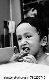 Starving Street Kids Eating Noodles In Black And White Colour Tone