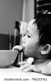 Starving Street Kids Eating Noodles In Black And White Colour Tone