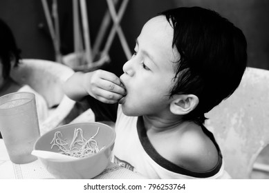 Starving Street Kids Eating Noodles In Black And White Colour Tone