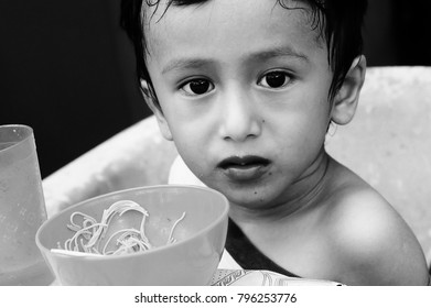 Starving Street Kids Eating Noodles In Black And White Colour Tone