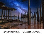 Stary sky milky way over a dilapidated old pier in Provincetown, Cape Cod, Massachusetts at night.