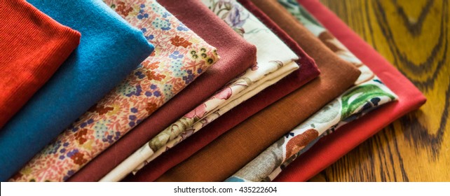 stash of fabrics for fall sewing projects 
