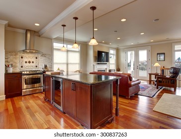 State of the art kitchen with deep stained cabinets, and stainless steel fridge. - Shutterstock ID 300837263