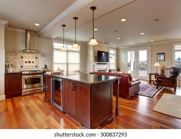 State of the art kitchen with deep stained cabinets, and stainless steel fridge. - Shutterstock ID 300837293