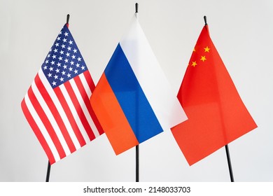 State Flags Of America, Russia, China On White Background. Russian Flag In Centre. Conflict Concept