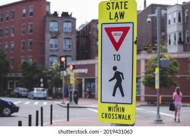 State Law Yield to Pedestrians Within Crosswalk sign, at a trail crossing, with space for text on the left