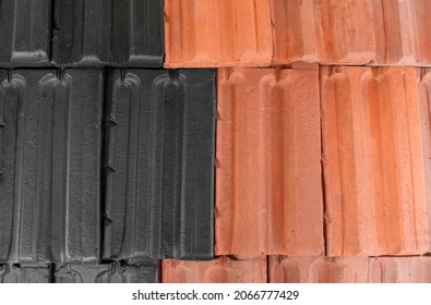 State of roof before and after painting. Half roof painted in black, half of tiles are still red. Before and after. Painting service. Black and red roof. Half done. Work at height.