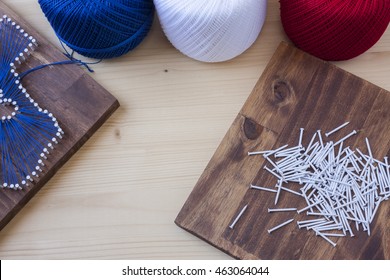 State String Art Crafts On A Wooden Background