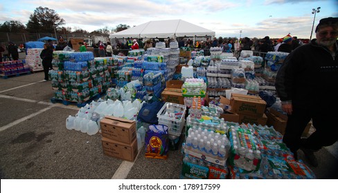 STATEN ISLAND, NEW YORK CITY - NOVEMBER 4 2012:Volunteers & National Guard Assembled At New Dorp High School To Render Aid To People Recovering From Hurricane Sandy.Stacks Of Supplies For Distribution