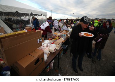 STATEN ISLAND, NEW YORK CITY - NOVEMBER 4 2012: Volunteers & National Guard Assembled At New Dorp High School To Render Aid To People Recovering From Hurricane Sandy. Hot Food For Those In Need