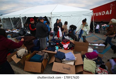 STATEN ISLAND, NEW YORK CITY - NOVEMBER 4 2012: Volunteers & National Guard Assembled At New Dorp High School To Render Aid To People Recovering From Hurricane Sandy. Donated Clothing Under Tent