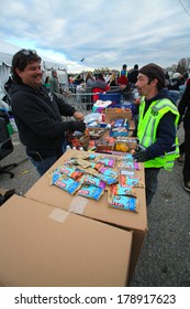 STATEN ISLAND, NEW YORK CITY - NOVEMBER 4 2012: Volunteers & National Guard Assembled At New Dorp High School To Render Aid To People Recovering From Hurricane Sandy. Free Snacks & Treats Set On Boxes