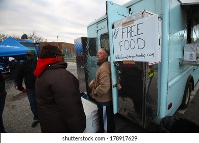 STATEN ISLAND, NEW YORK CITY - NOVEMBER 4 2012: Volunteers & National Guard Assembled At New Dorp High School To Aid People Recovering From Hurricane Sandy. Volunteer Caterers Offer Free Meals