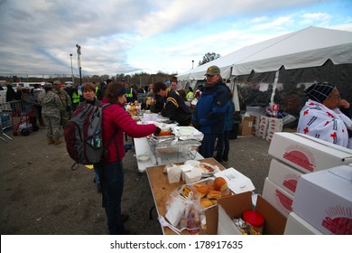 STATEN ISLAND, NEW YORK CITY - NOVEMBER 4 2012: Volunteers & National Guard Assembled At New Dorp High School To Render Aid To People Recovering From Hurricane Sandy. Food Supplies Distributed