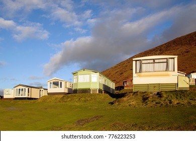 Static Caravan Holiday Homes At Llangennith On The Gower Peninsular In Winter Which Is Out Of Season, The Caravans Are Closed Up Until Spring And The Park Is Empty Of People. 