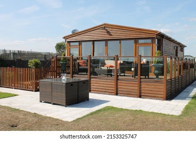 Static caravans and lodges on holiday parks - Shutterstock ID 2153325747