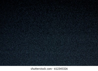 Static noise coming from an old analog tv screen, shot in the darkness. Real footage, real moirè.
 - Shutterstock ID 612345326