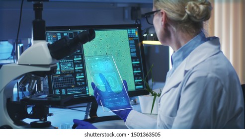 Static Shot Of A Female Scientist Using A Portable Holographic Display Screen For Research