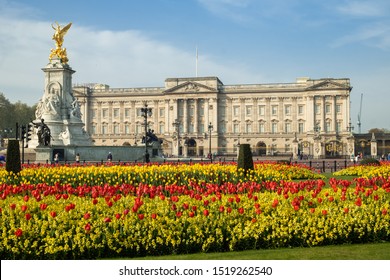 Static Wide Shot Of Spring Flowers In Front Of Buckingham Palace, London. Taken Early Morning With Few People