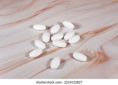 Statin Tablets Spilled Out On A Marble Counter.