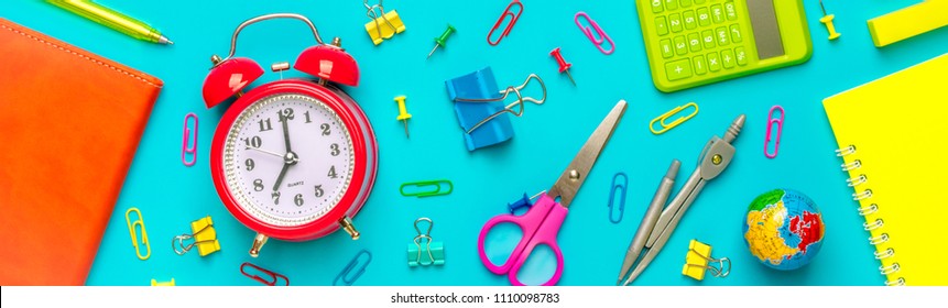 Stationary, Back To School,summer Time, Creativity And Education Concept.Supplies- Scissors, Pencils, Paper Clips,note,stapler And Notepad, Globe On Blue Background,flatlay.Mock Up.Top View Banner