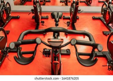 Stationary Bicycles. Indoor Cycling For Lifestyle Design. Fitness Background. Class With Empty Bikes. Soft Focus Background.