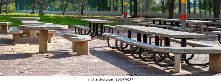 Stationary Picnic Tables In A Recreation Park. No People.