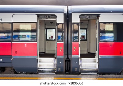 Stationary train with open cars doors