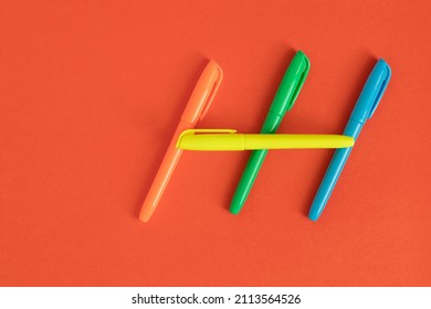 Stationery, Colored Markers On A Red Background. Office Items