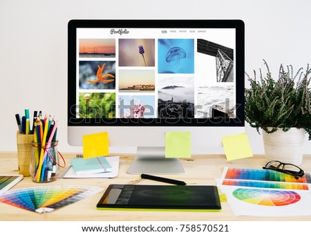  Stationery desktop with design stuff, computer and graphic tablet. photo porfolio.