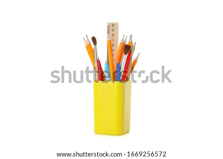 Stationery in holder isolated on white background