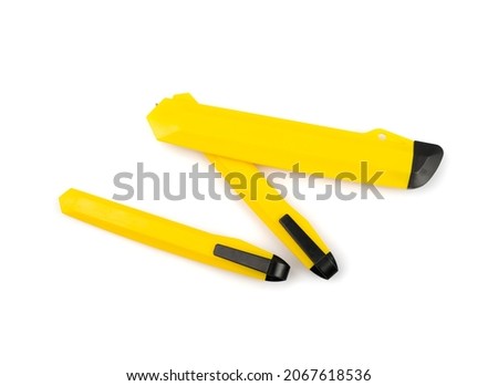 Stationery knife isolated. Yellow plastic paper knife, razor office box cutter, construction knife on white background