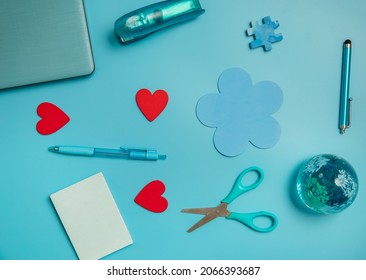 Stationery And Laptop Over Blue Background, Education, Business Or Learning Concept, Flatlay Of School Or Home Office Items. 