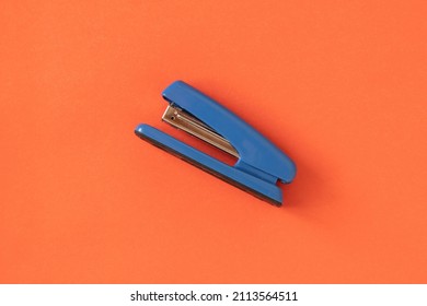 Stationery, Stapler On A Red Background. Office Items