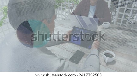 Statistical data processing against african american man using digital tablet. global finance and business technology concept