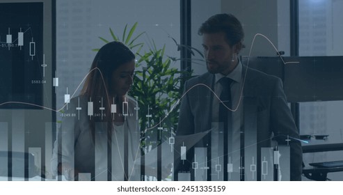 Statistical data processing against caucasian businessman and businesswoman discussing at office. business data and analytics technology concept