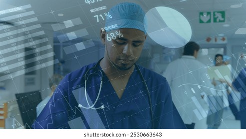 Statistical data processing over portrait of biracial male surgeon smiling at hospital. Medical healthcare and technology concept - Powered by Shutterstock