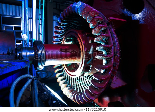 Stator generators of a big\
electric motor in the coal fired power plant factory\
manufacturing.