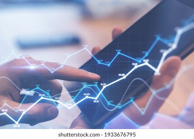 Stats data concept with digital analytical indicators and digital tablet in man hands on background. Double exposure