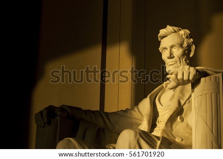 Statue of Abraham Lincoln in brilliant warm morning dramatic sunlight