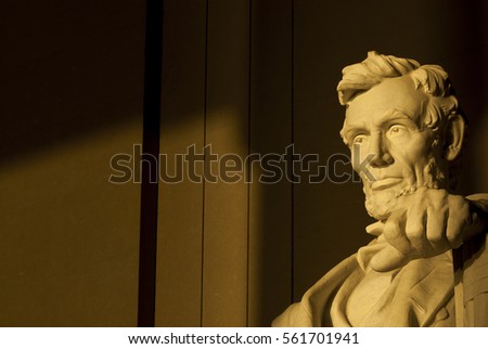 Statue of Abraham Lincoln in brilliant warm morning dramatic sunlight