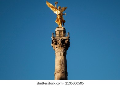 Statue of The Angel of Independence is a victory column monument in downtown CDMX Mexico City, México.  Bronze sculpture of Nike, the Greek goddess of Victory, symbolizing law, war, justice and peace.