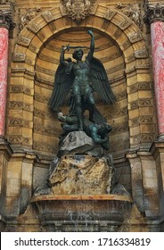 the statue of the Angel and Lucifer at the Latin neighborhood in Paris France 
